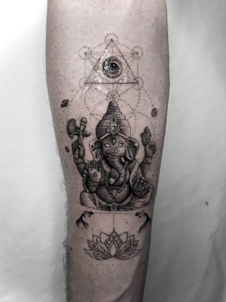 Premium Vector | Lord ganesha symbol with tattoo design