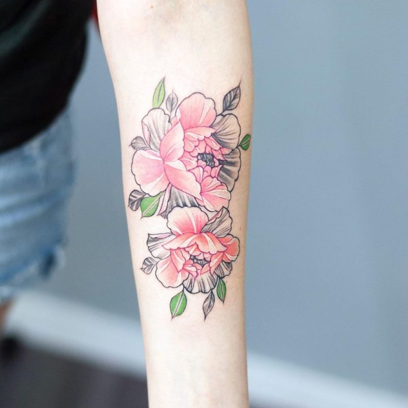 Blackwork ornamental peony tattoo on the forearm.